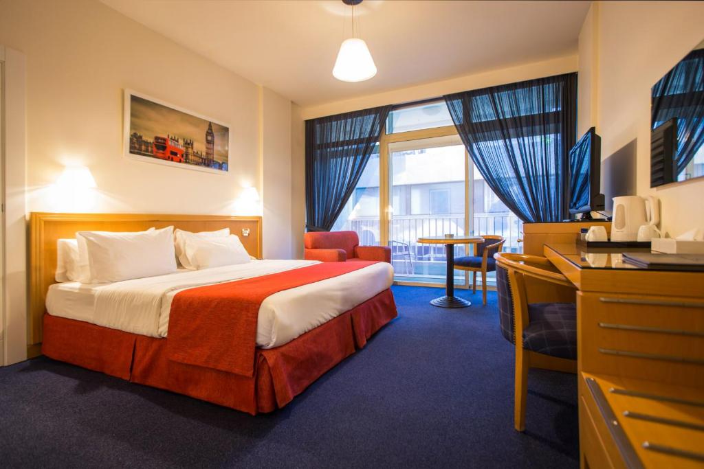 Postel nebo postele na pokoji v ubytování Hotel Cavalier