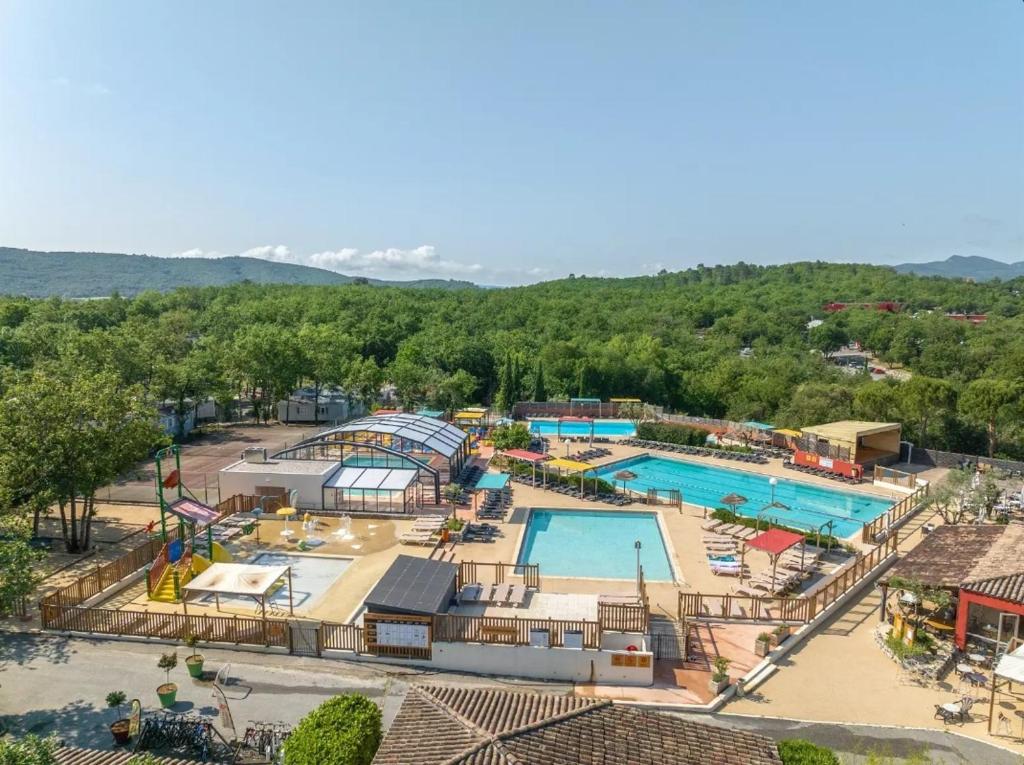 an overhead view of a water park with two pools at The Mobil home Confort Clim / 2 Chb / 5 Pers in Lagorce