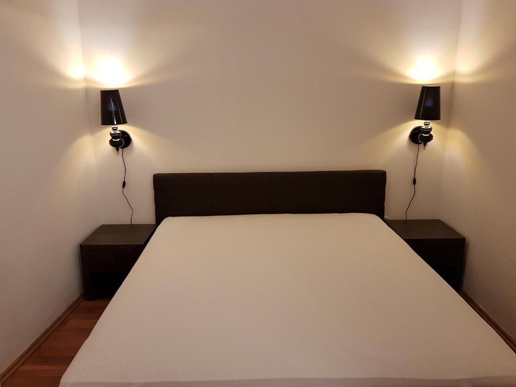 Posteľ alebo postele v izbe v ubytovaní Apartman Kaszás Central