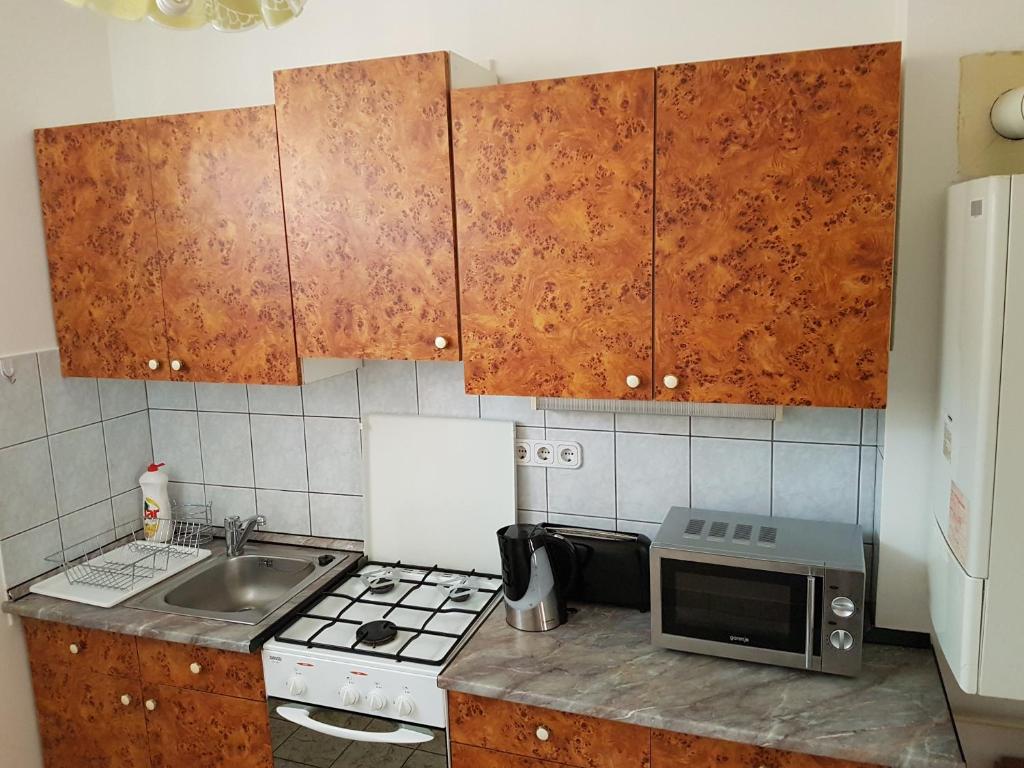 Kuchyňa alebo kuchynka v ubytovaní Apartman Kaszás Central