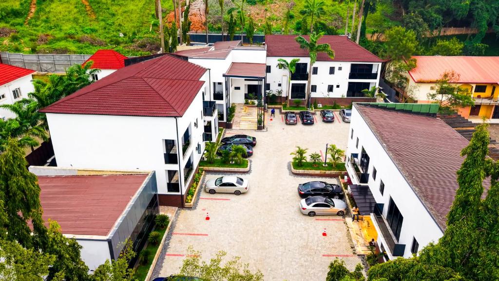 an aerial view of a town with cars parked in a parking lot at Aurum on Missouri in Abuja