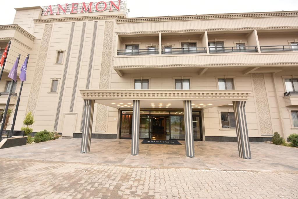 a hotel with the entrance to a building at Anemon Grand Şanlıurfa in Göktepe