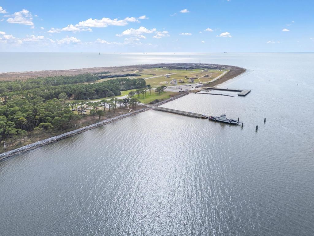 an aerial view of a dock on a body of water at The Dunes 101 by Vacation Homes Collection in Fort Morgan