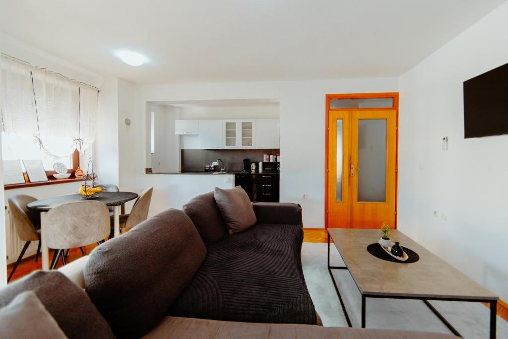 a living room with a couch and a table at Apartman Deja vu in Livno