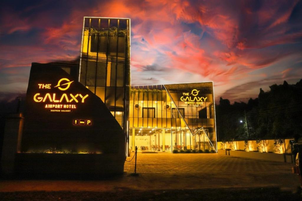 a building at night with a cloudy sky at The Galaxy Airport Hotel in Negombo
