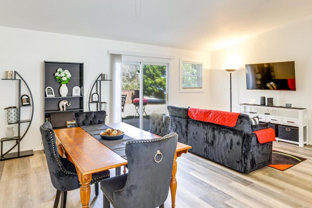 a living room with a table and a couch at Work, Explore & Unwind: Greenville Getaway w/ Yard in Greenville