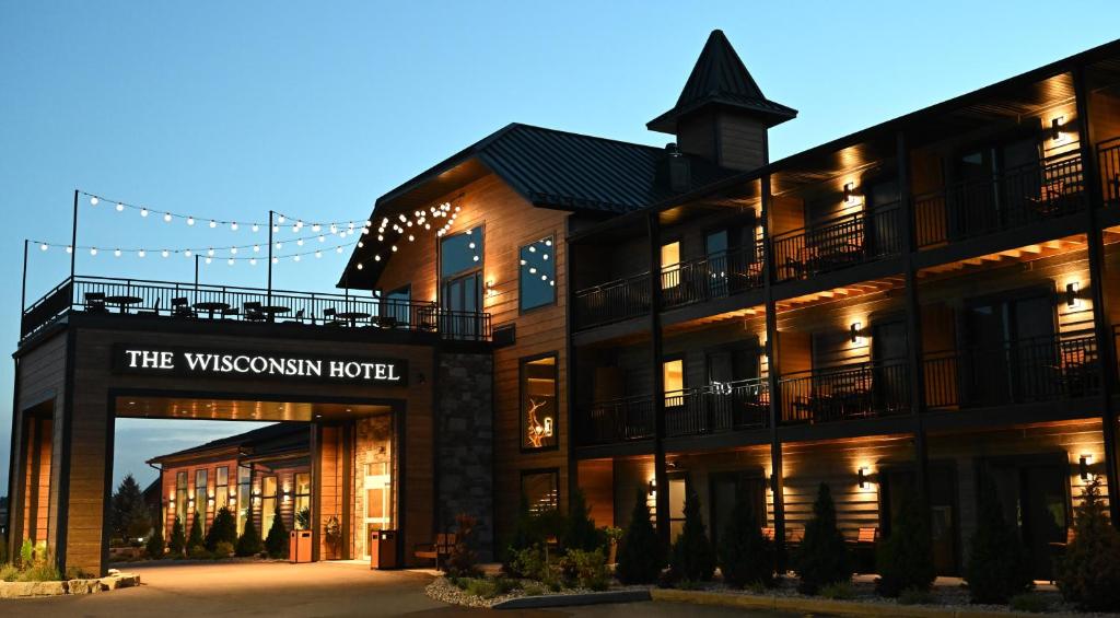 a building with a sign that reads the wysswegian hotel at The Wisconsin Hotel & Conference Center in Wisconsin Dells
