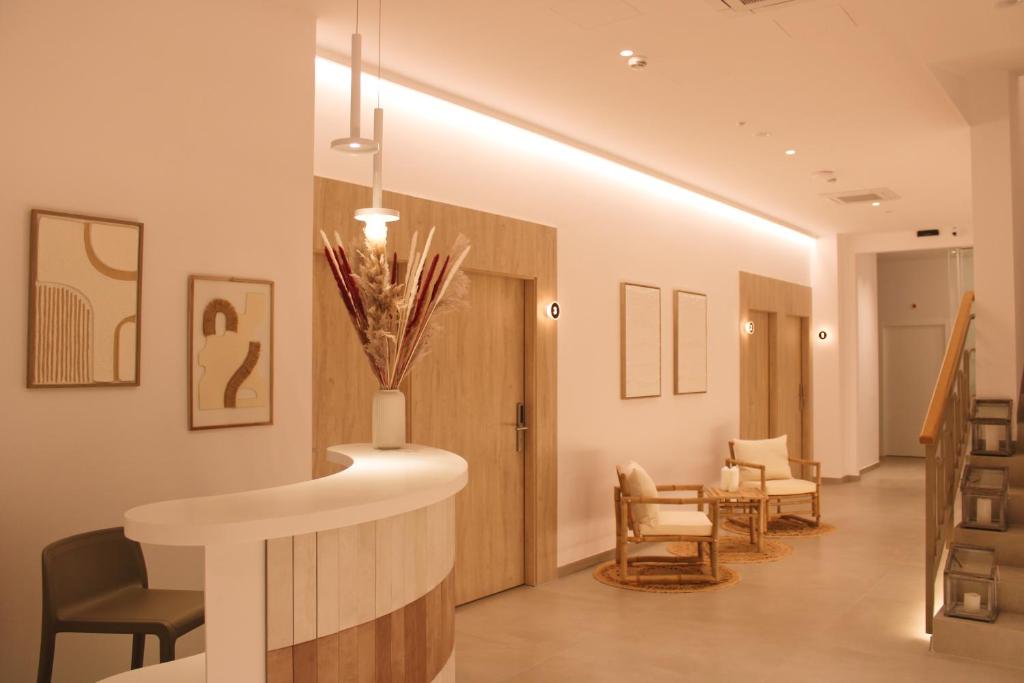a hallway with a waiting room with chairs at HA Hotel TESORO MEDITERRANEO in Almuñécar