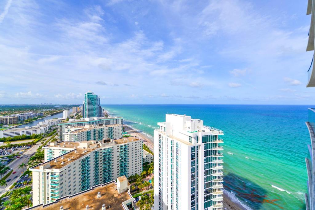 an aerial view of the ocean and buildings at Oceanfront Escape - Rooftop Pool & Beach Access in Hollywood