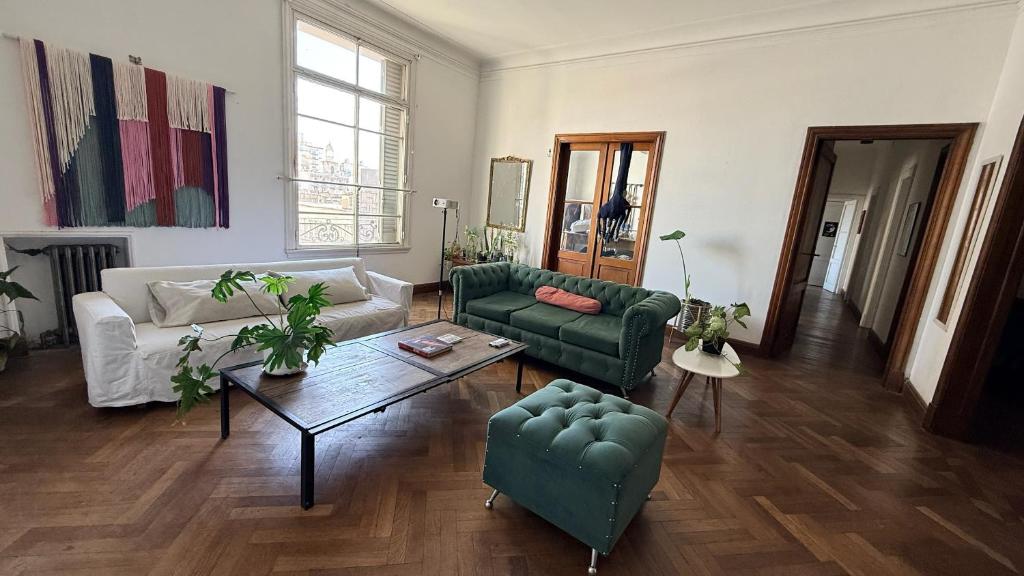 a living room with two couches and a coffee table at Home lab studio in Córdoba