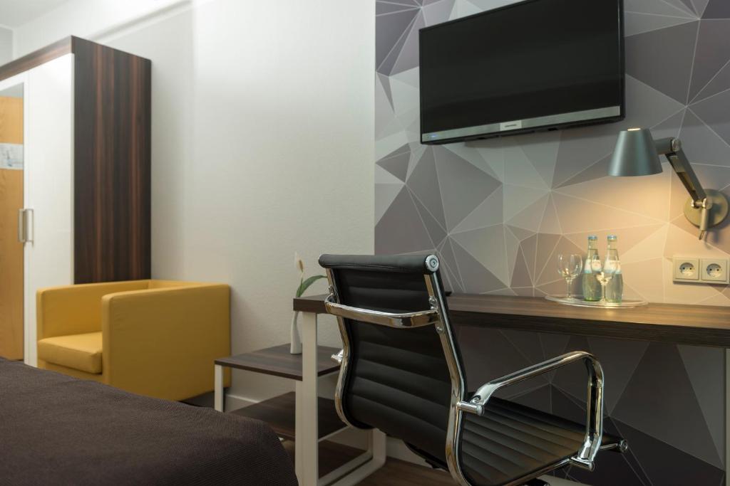 TV a/nebo společenská místnost v ubytování Best Western Hotel Braunschweig Seminarius