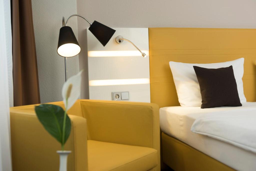 Postel nebo postele na pokoji v ubytování Best Western Hotel Braunschweig Seminarius