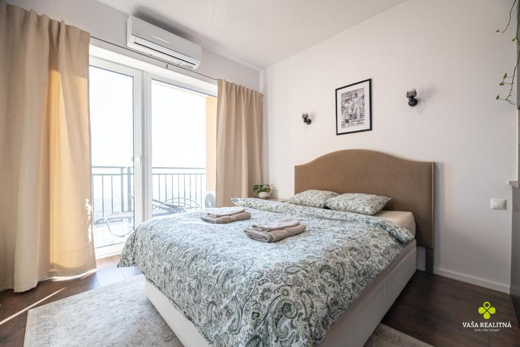 a bedroom with a bed with two pillows on it at Castle Studio 7 Bojnice in Bojnice