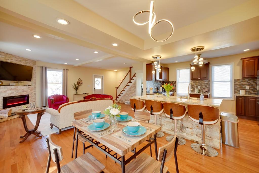 a kitchen and living room with a table and chairs at Walk to Kinnickinnic Ave! Newly Updated Abode in Milwaukee