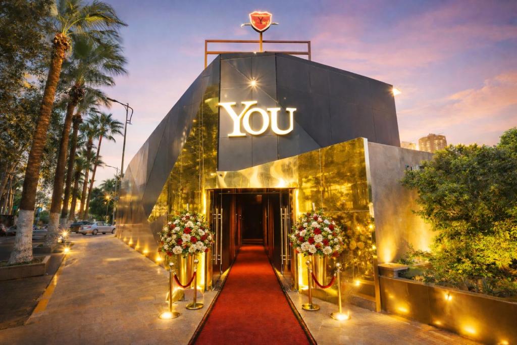a large building with a yvette sign on it at YOU Nile View Hotel in Cairo