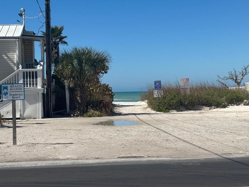 a house on the beach next to the ocean at LasPalmas Beach Rentals,3 in Bradenton Beach