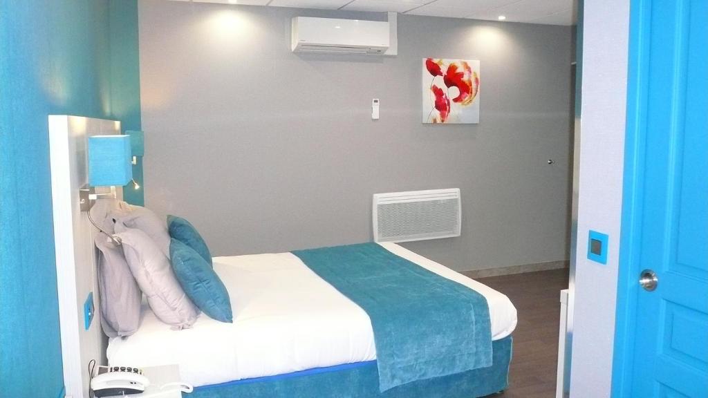 Postel nebo postele na pokoji v ubytování Hôtel L'Européen