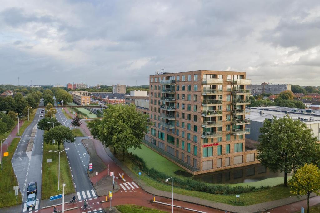 an aerial view of a building in a city at Leonardo Hotel Papendrecht in Papendrecht