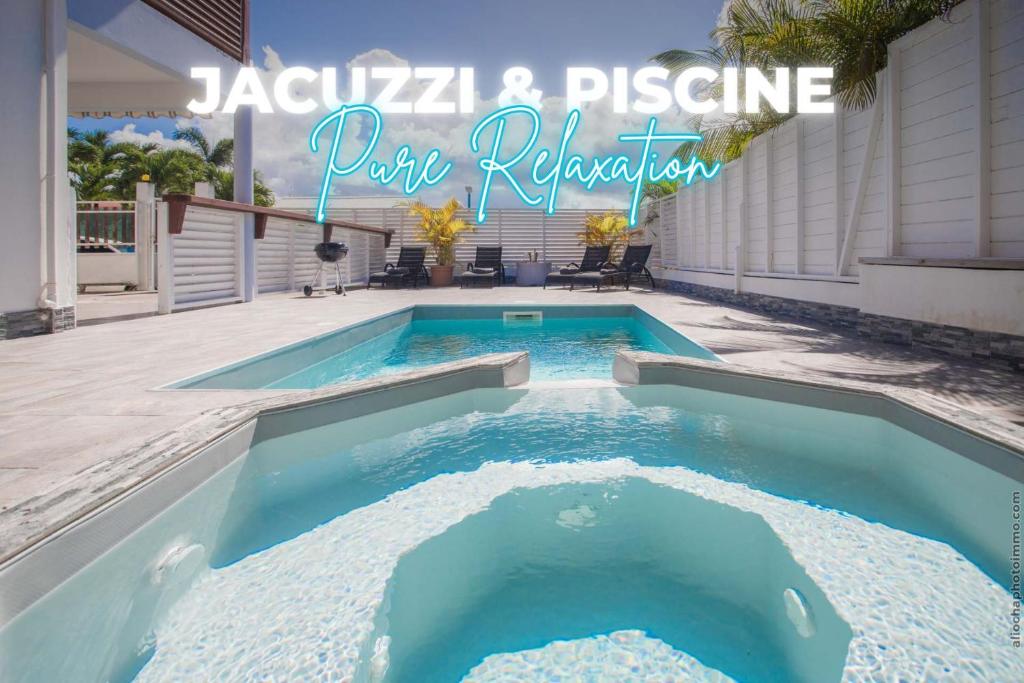 a swimming pool in a backyard with a sign that reads jacuana and pleasure at Villa 2 chambres, Jacuzzi et Piscine in Maximin
