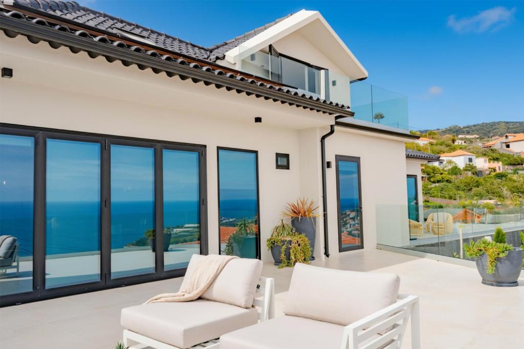 a villa with a view of the ocean at Ocean View Villa, Private Pool and Terrace in Santa Cruz