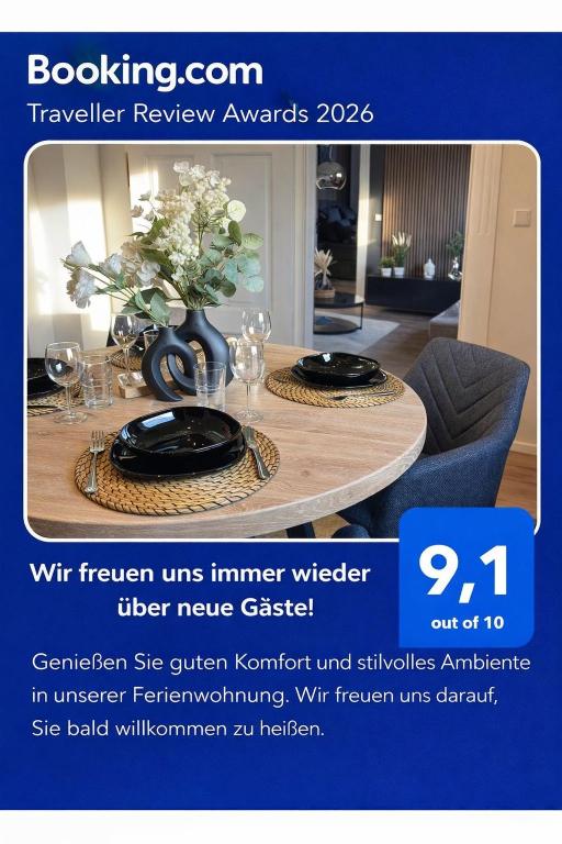 a flyer with a table with plates and a vase on it at Belm Ferienwohnung am Bach in Belm