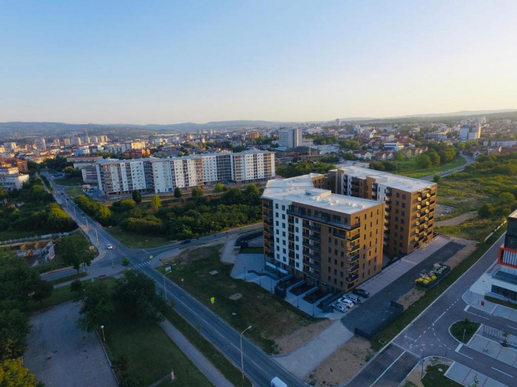 an aerial view of a city with tall buildings at I&I Tesla IV in Kragujevac