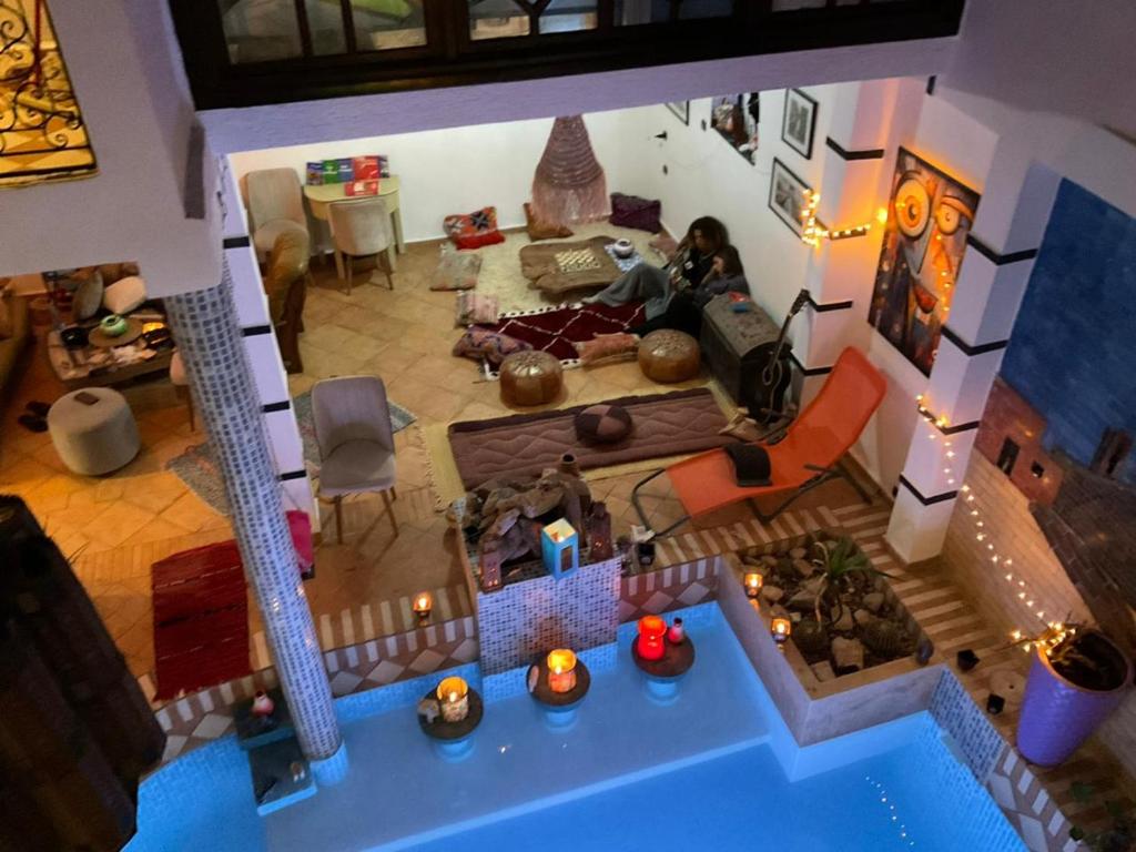 an overhead view of a living room with a house at sharing is caring in Tamraght Ouzdar