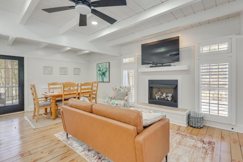 a living room with a couch and a fireplace at Beach Access & Fire Pit! Potomac River Retreat in Montross