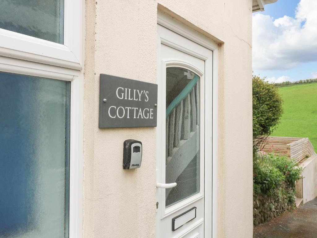 a sign on a door of a coffee shop at Gilly's Cottage in Kingsbridge
