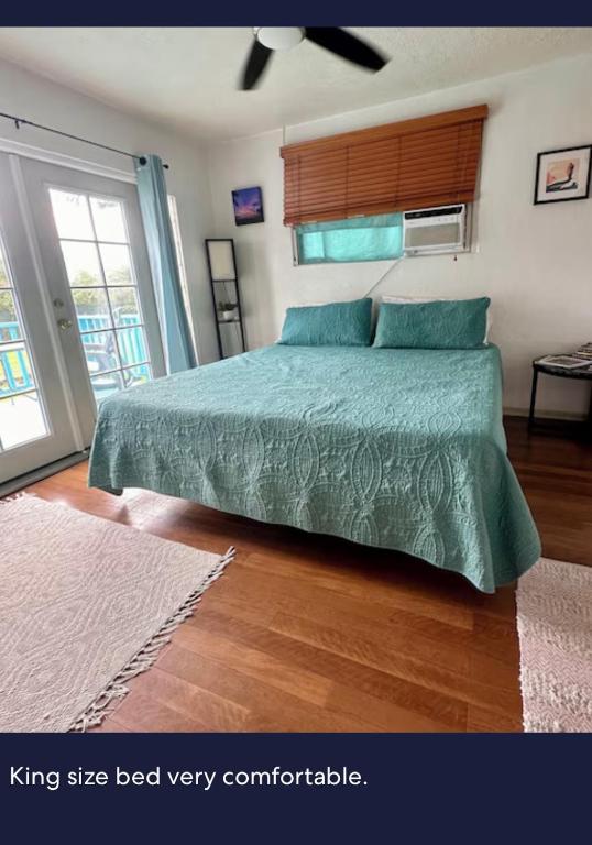 a bedroom with a king size bed very comfortable at Surfers Dream Studio in Waianae