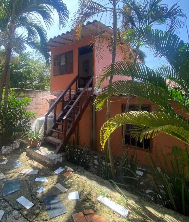 a house with a staircase leading up to it at Apartaestudio con balcón cerca al mar in Puerto Colombia