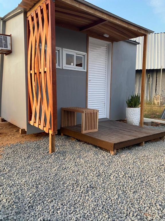 a wooden deck in front of a house at Tiny House in Boa Vista