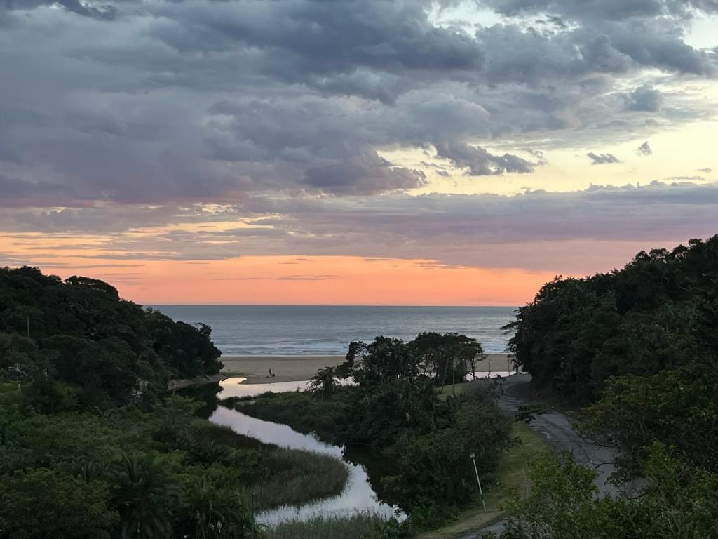 a view of a beach with the ocean at Amapondo in Port St. Johns