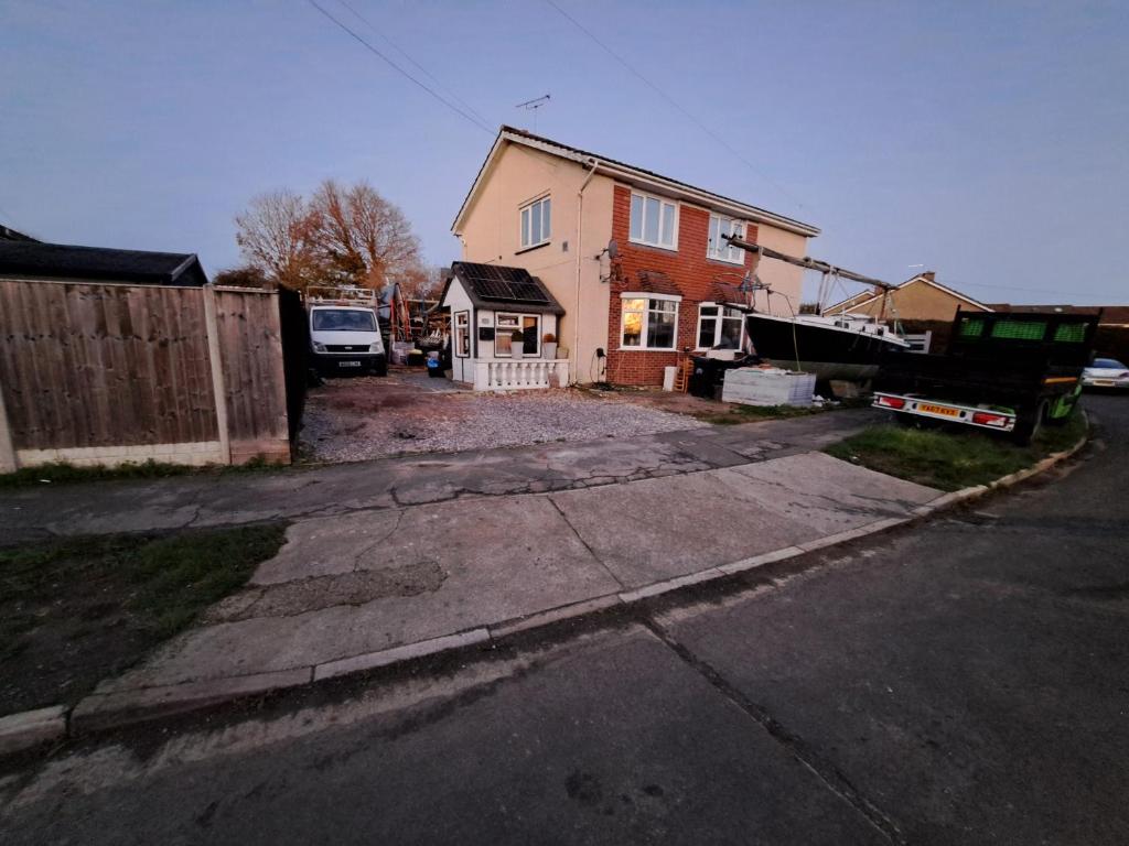 a house that is being remodeled with a driveway at The Old Chip Shop in Ilchester