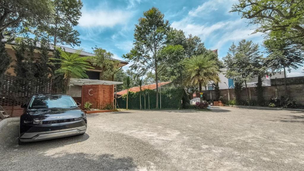 a car parked in front of a house at C Family Hotel in Citeureup 1