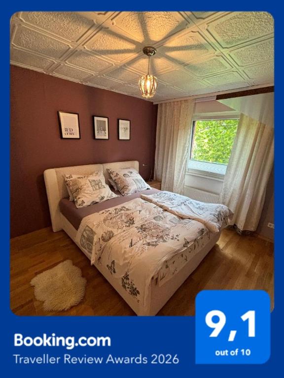 a bedroom with a bed and a window at Südharzperle in Bad Lauterberg