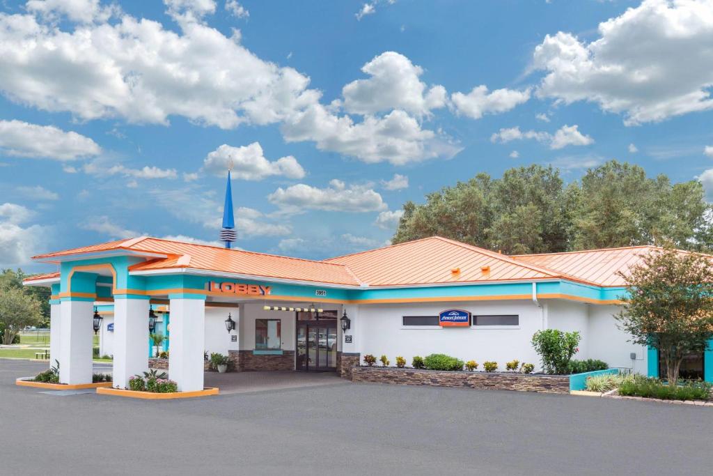 a gas station in a parking lot at Howard Johnson by Wyndham Ocala FL I-75 in Ocala
