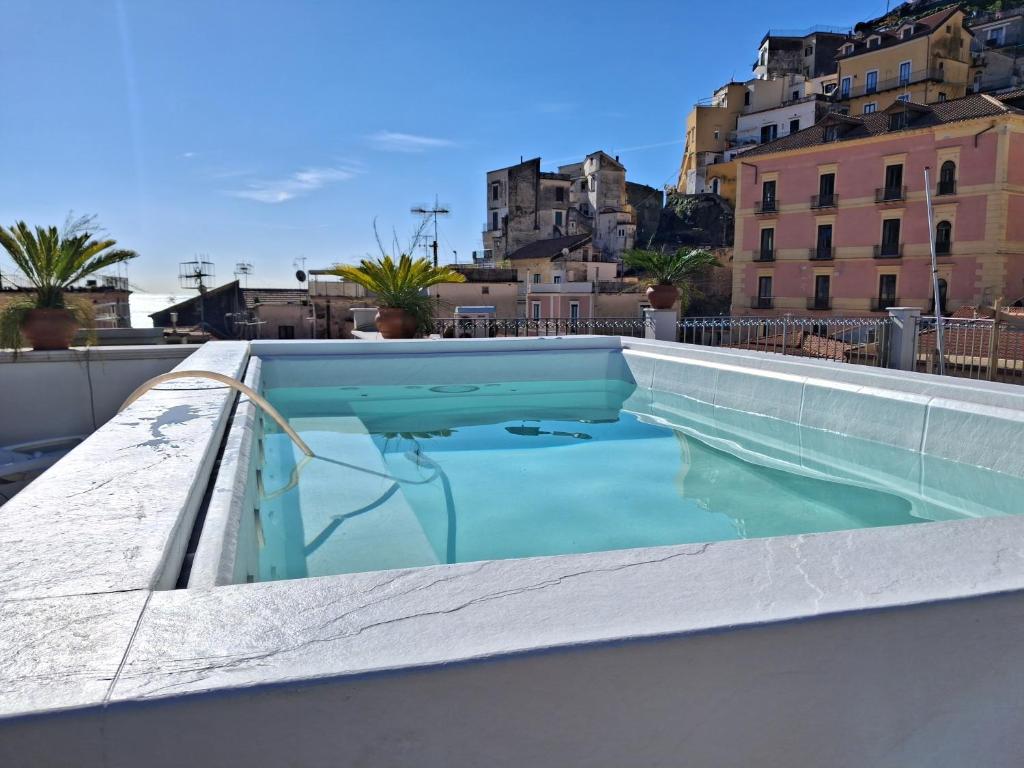a swimming pool on the roof of a building at Hotel Santa Lucia in Minori