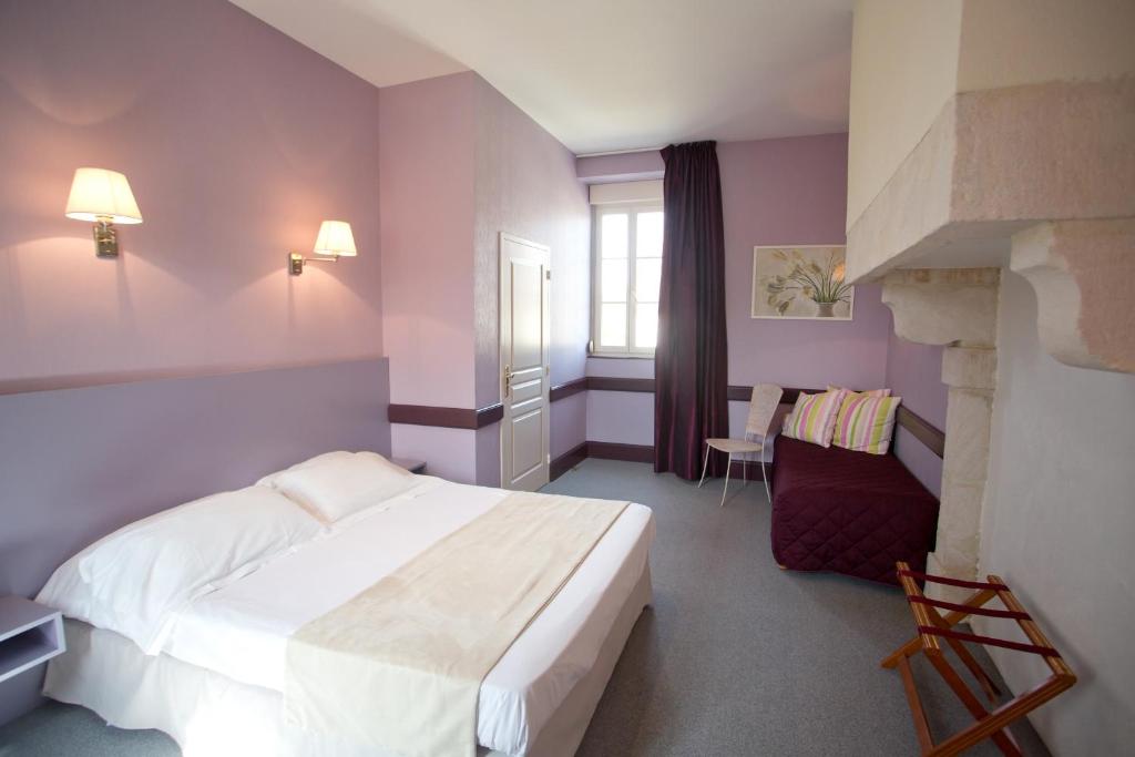 Postel nebo postele na pokoji v ubytování Hotel l'Orée Des Vignes