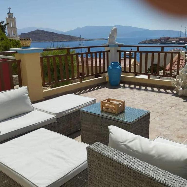 a patio with a view of the water at Villa Efraim Amalia in Halki