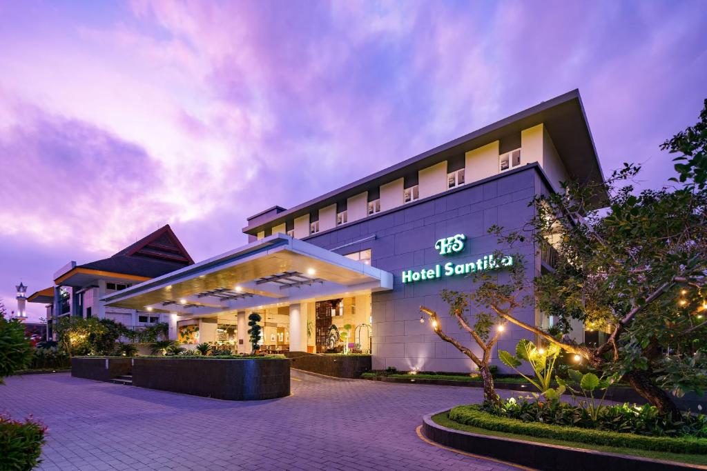 a building with a hotel santatal sign on it at Hotel Santika Mataram in Mataram