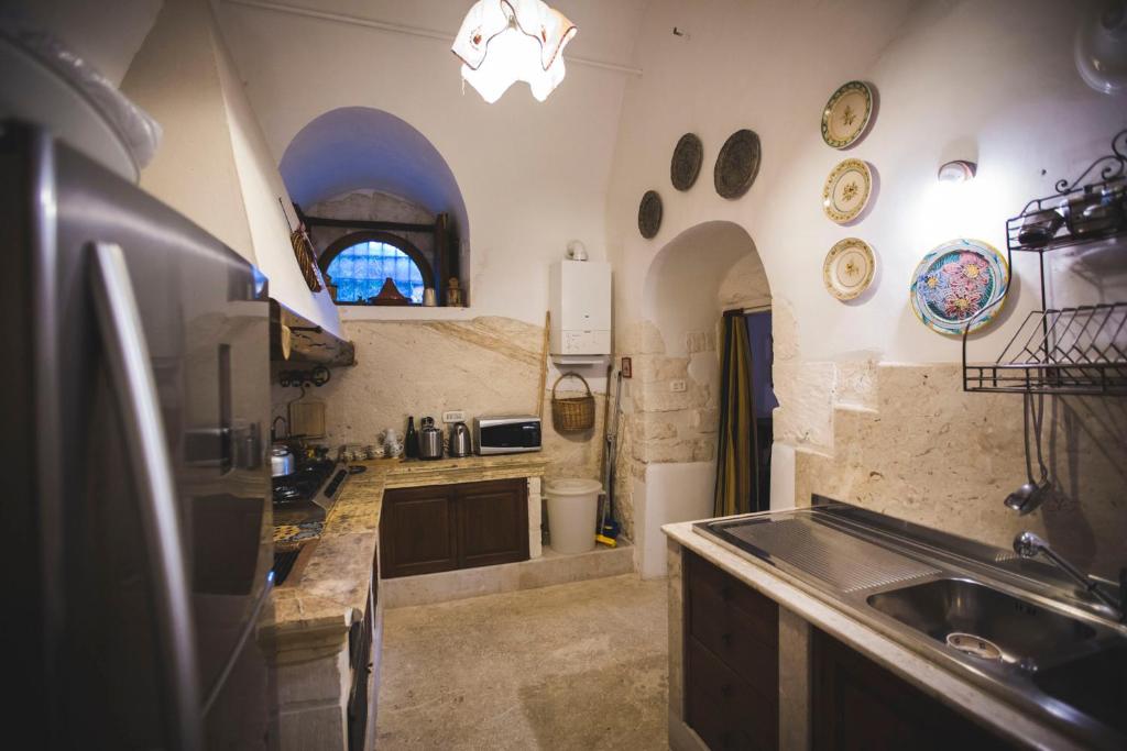 Kuchyň nebo kuchyňský kout v ubytování Villa Manganaro