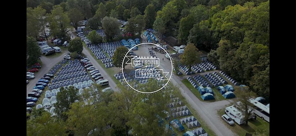 an aerial view of a parking lot with cars at Beer Base-Camp Oktoberfest camping with free welcome beer and traditional dirndl-lederhosen shop in Munich