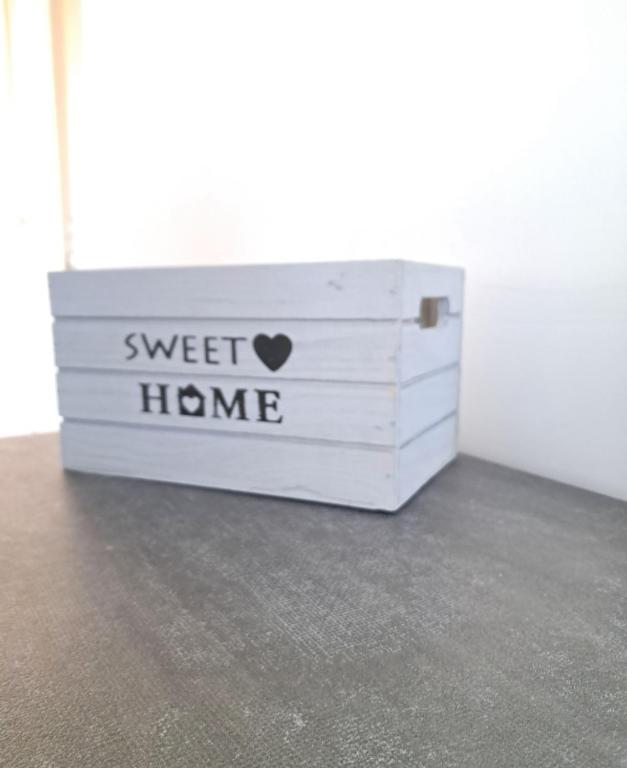 a white chest with the words sweet home on it at Sweet home in Novara