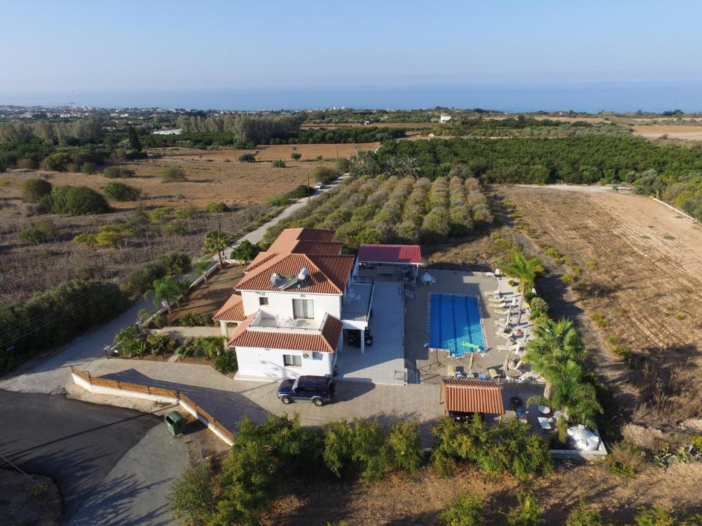 an aerial view of a house with a swimming pool at Nayia Paradise Villa! Best Villa in Cyprus in Paphos City