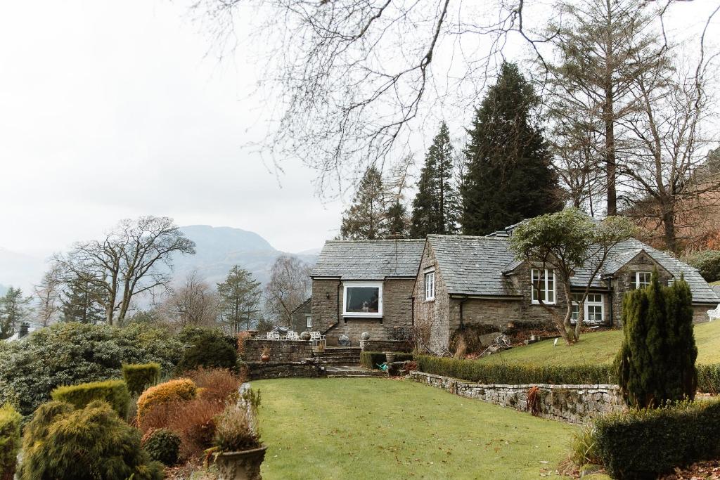 a house with a large yard in front of it at Grey Walls in Penrith