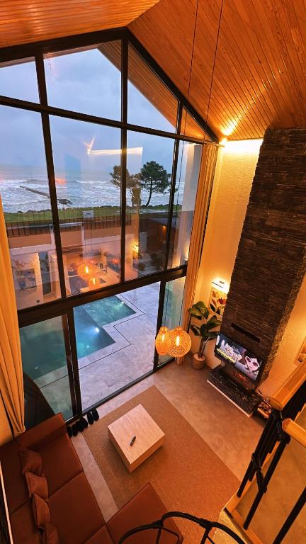 a view of a living room with a view of the ocean at Villa Bella in Atakum