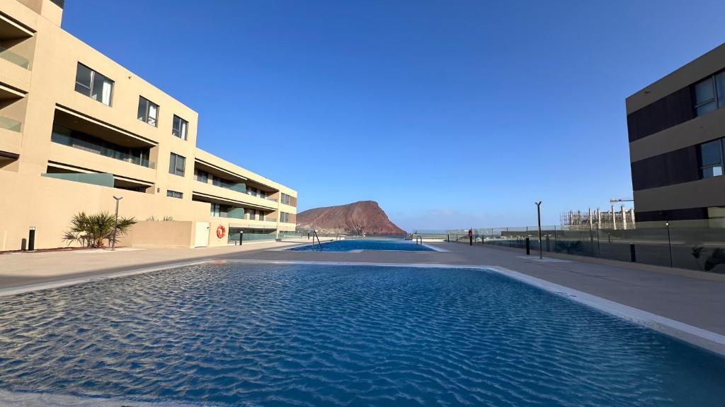a large swimming pool in front of a building at La Tejita "Vida" by BE HAPPY in La Tejita