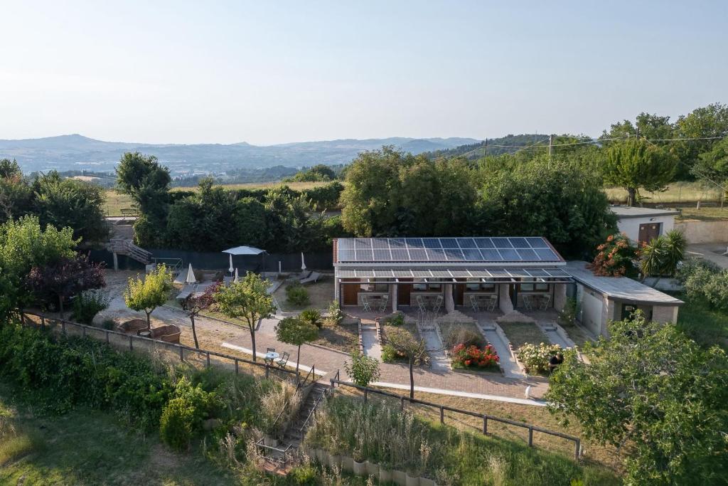 an aerial view of a garden with a greenhouse at Semivaganti Agritur in Candelara