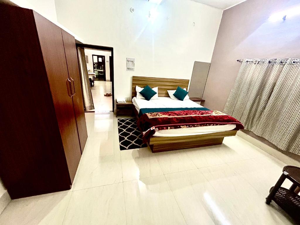 a bedroom with a bed in a room at Markandey Bhavan in Deoghar